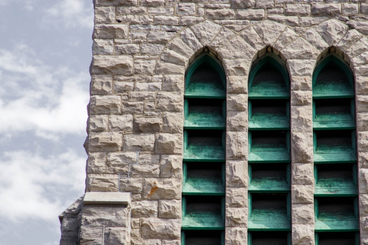 A stone church with arched windows